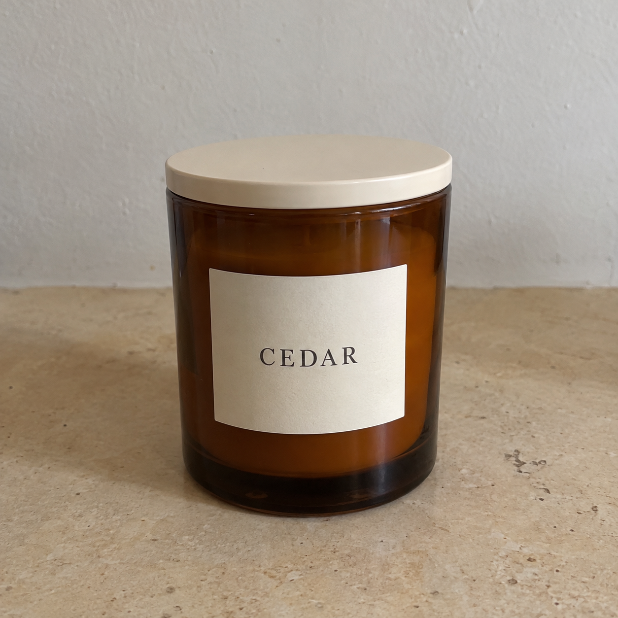 Fictional CEDAR candle on an ordinary kitchen tabletop before the illustrative edit